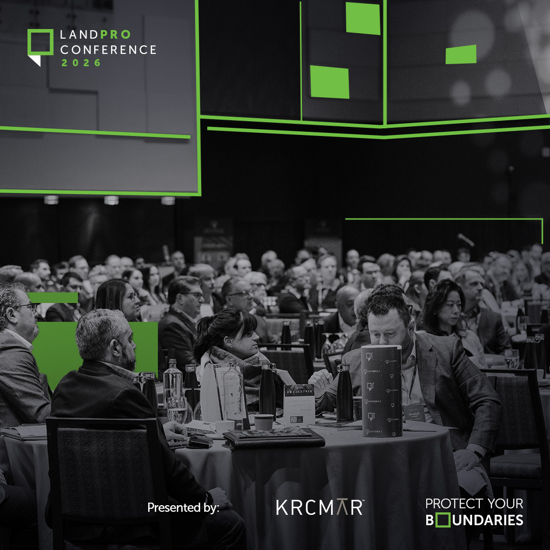 A crowd of attendeees watches the stage